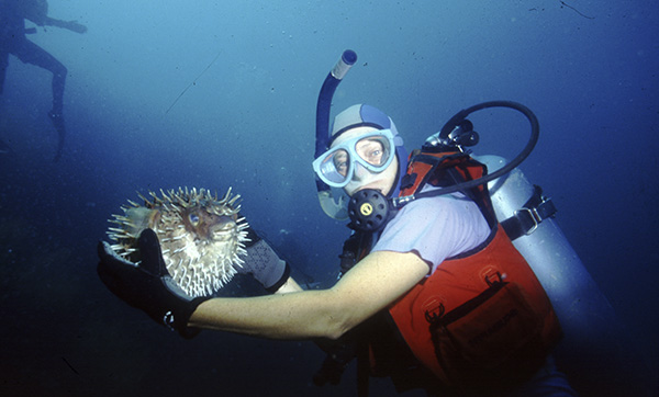 Susan holding a puffer fish. Courtesy Craig Thomas